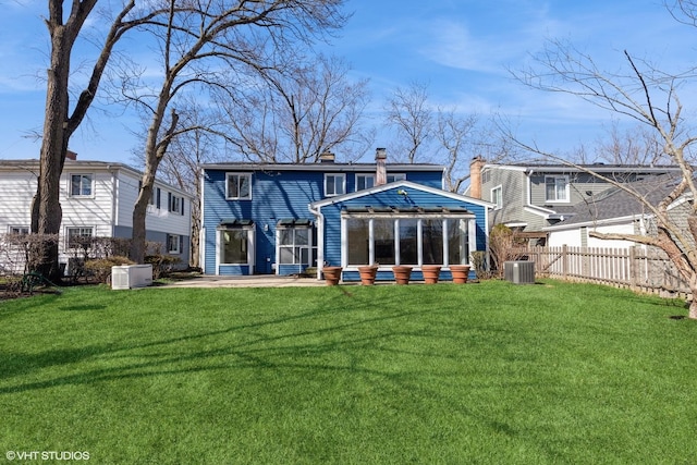 127 Riverside Dr, Northfield, IL 60093 - rear view of property with a yard, central air condition unit, a chimney, and fence