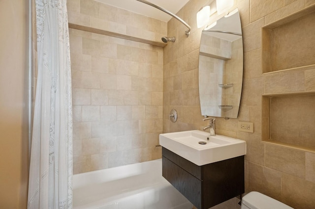 247 E Chestnut St Unit 2303, Chicago, IL 60611 - full bathroom with tile walls, shower / bath combo with shower curtain, toilet, and vanity