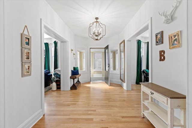 1833 Asbury Ave, Evanston, IL 60201 - entryway with a chandelier, light wood-type flooring, and baseboards