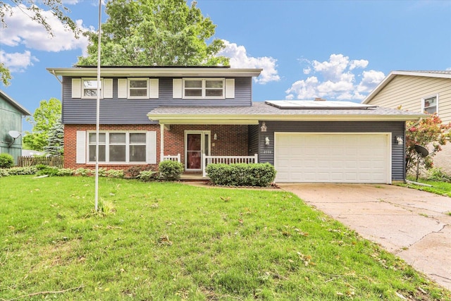 2506 S Cottage Grove Ave, Urbana, IL 61801 - view of front facade featuring a porch, a garage, concrete driveway, roof mounted solar panels, and brick siding