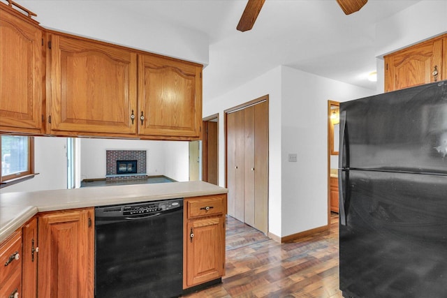 2506 S Cottage Grove Ave, Urbana, IL 61801 - kitchen with black appliances, ceiling fan, wood finished floors, light countertops, and brown cabinetry