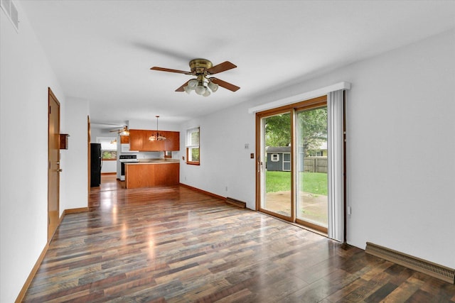 2506 S Cottage Grove Ave, Urbana, IL 61801 - unfurnished living room featuring ceiling fan, dark wood-style flooring, and baseboards