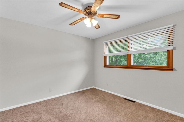 2506 S Cottage Grove Ave, Urbana, IL 61801 - empty room featuring carpet, ceiling fan, and baseboards