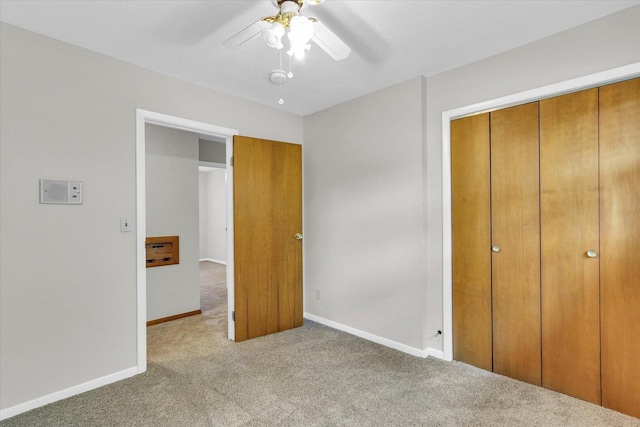 2506 S Cottage Grove Ave, Urbana, IL 61801 - unfurnished bedroom featuring carpet flooring, baseboards, a closet, and ceiling fan