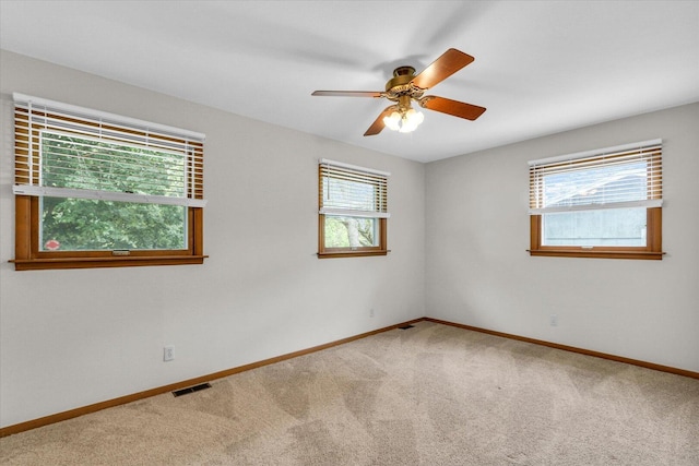 2506 S Cottage Grove Ave, Urbana, IL 61801 - empty room featuring carpet flooring, baseboards, and ceiling fan