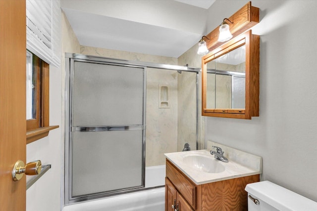 2506 S Cottage Grove Ave, Urbana, IL 61801 - bathroom featuring toilet, vanity, and enclosed tub / shower combo