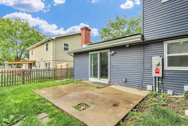 2506 S Cottage Grove Ave, Urbana, IL 61801 - back of property with a patio area and a chimney