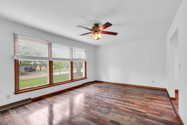 2506 S Cottage Grove Ave, Urbana, IL 61801 - empty room with wood finished floors, a baseboard heating unit, a ceiling fan, and baseboards