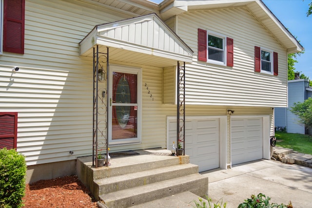 24221 S Edwin Dr, Channahon, IL 60410 - property entrance with driveway and a garage