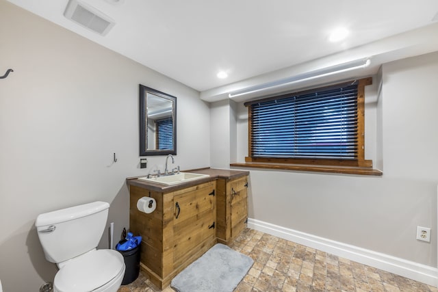 24221 S Edwin Dr, Channahon, IL 60410 - bathroom with vanity, stone finish floors, and recessed lighting