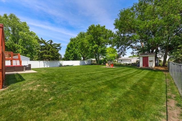 24221 S Edwin Dr, Channahon, IL 60410 - fenced backyard with a storage unit
