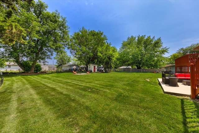 24221 S Edwin Dr, Channahon, IL 60410 - fenced backyard with outdoor lounge area, a shed, and a patio