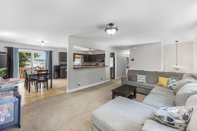 24221 S Edwin Dr, Channahon, IL 60410 - living area with light carpet and a chandelier