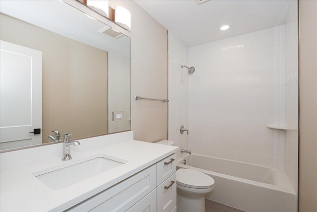bathroom featuring toilet, recessed lighting, shower / washtub combination, and vanity