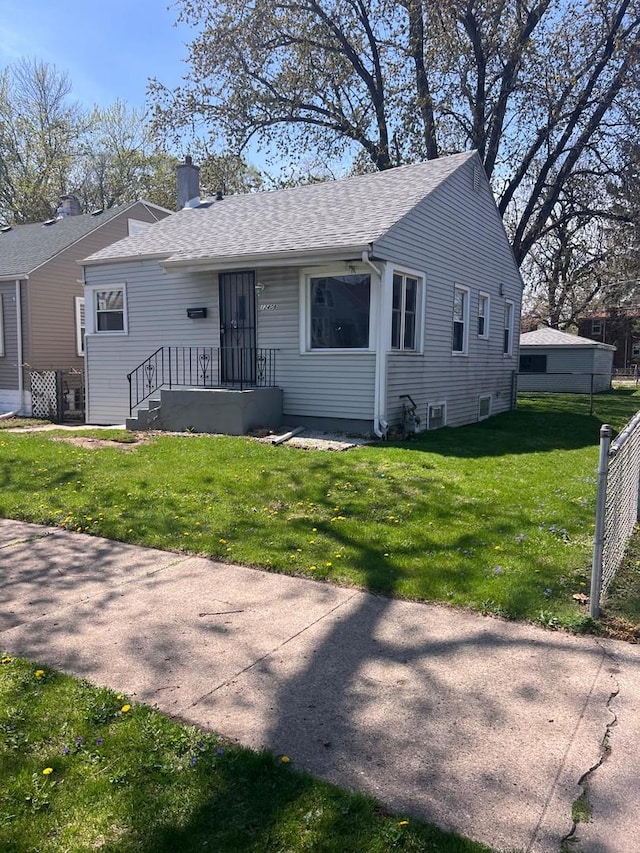 12408 S Carpenter St, Calumet Park, IL 60827 - single story home with a shingled roof, a front yard, and a chimney