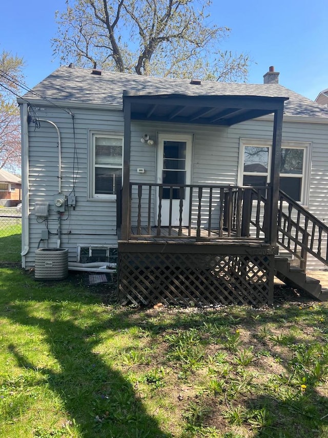 12408 S Carpenter St, Calumet Park, IL 60827 - back of house with a yard, a deck, a chimney, and a shingled roof