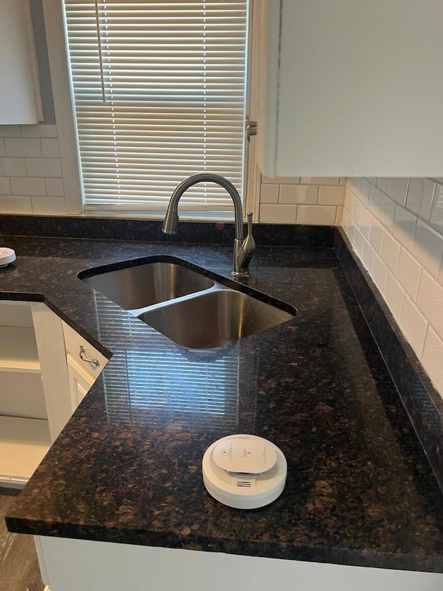 12408 S Carpenter St, Calumet Park, IL 60827 - details with a sink, decorative backsplash, dark stone countertops, and white cabinetry