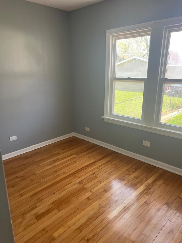 12408 S Carpenter St, Calumet Park, IL 60827 - empty room featuring light wood-style floors and baseboards