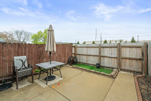 view of patio featuring fence