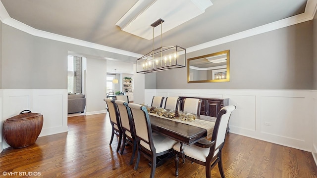 11050 Deer Haven Ln, Orland Park, IL 60467 - dining space with ornamental molding, a decorative wall, wood finished floors, a chandelier, and a wainscoted wall