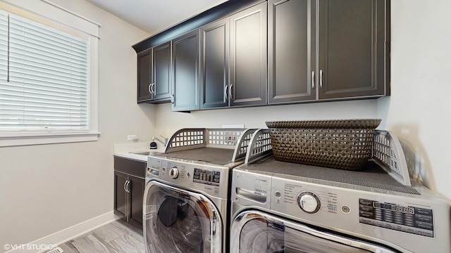 11050 Deer Haven Ln, Orland Park, IL 60467 - laundry room featuring independent washer and dryer, cabinet space, and baseboards