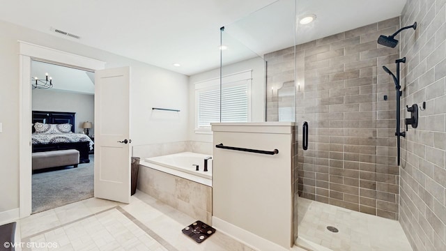 11050 Deer Haven Ln, Orland Park, IL 60467 - ensuite bathroom featuring tile patterned floors, a shower stall, a garden tub, and recessed lighting