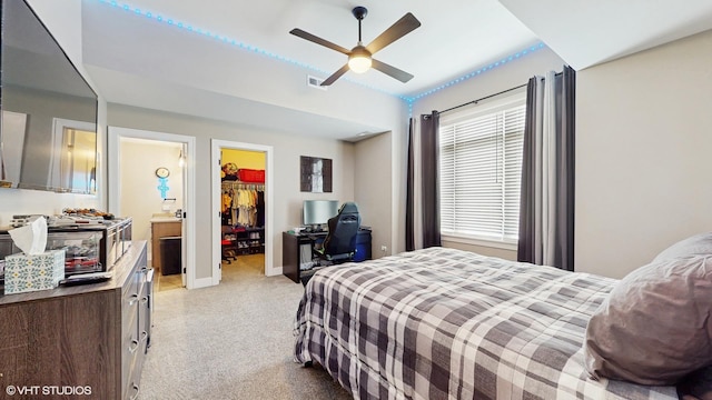 11050 Deer Haven Ln, Orland Park, IL 60467 - bedroom with light colored carpet, a walk in closet, a closet, a ceiling fan, and baseboards