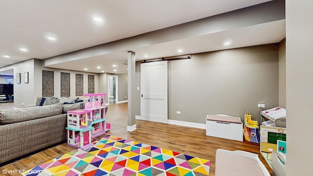 11050 Deer Haven Ln, Orland Park, IL 60467 - playroom featuring wood finished floors, recessed lighting, a barn door, and baseboards