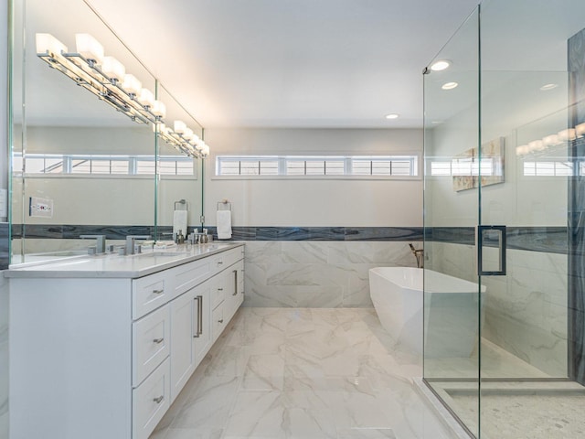 full bathroom featuring a stall shower, recessed lighting, tile walls, vanity, and marble finish floor
