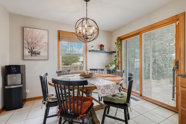 dining area featuring visible vents, baseboards, light tile patterned floors, and a chandelier