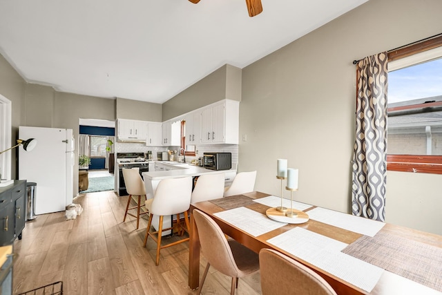 13134 S Burley Ave, Chicago, IL 60633 - dining space with a toaster, ceiling fan, and light wood finished floors