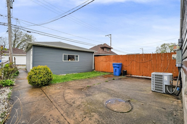 13134 S Burley Ave, Chicago, IL 60633 - view of patio / terrace featuring an outdoor structure, fence, and central AC unit