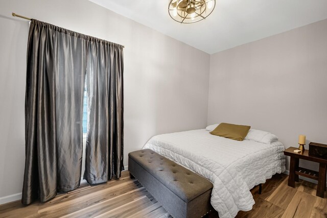 13134 S Burley Ave, Chicago, IL 60633 - bedroom with light wood-style flooring and baseboards