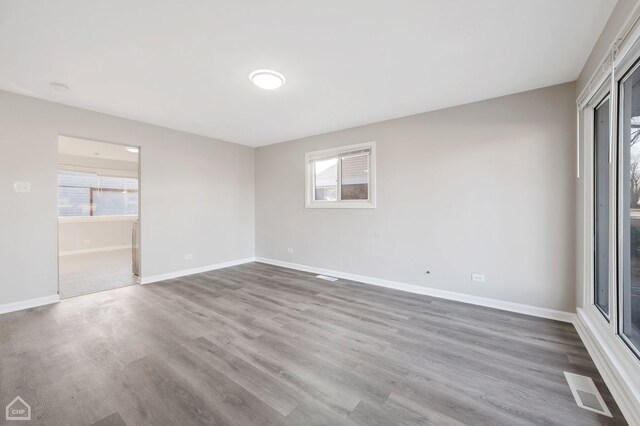 689 E 155th St, South Holland, IL 60473 - unfurnished bedroom with visible vents, wood finished floors, and baseboards