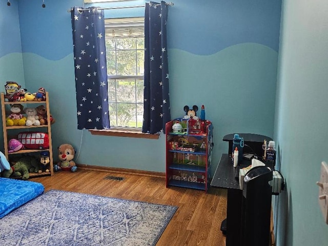 2186 Shadow Creek Ct N, Vernon Hills, IL 60061 - bedroom with wood finished floors, multiple windows, and baseboards