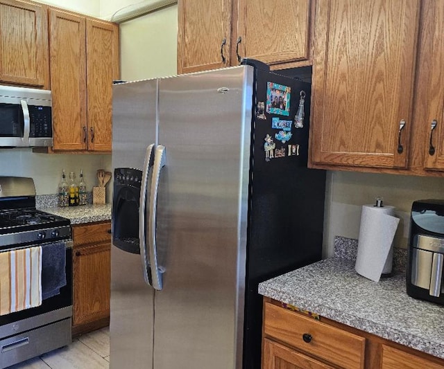 2186 Shadow Creek Ct N, Vernon Hills, IL 60061 - kitchen featuring stainless steel appliances and brown cabinets