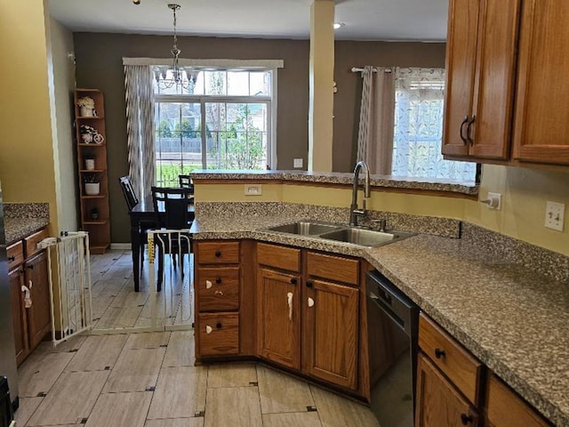 2186 Shadow Creek Ct N, Vernon Hills, IL 60061 - kitchen with a sink, black dishwasher, brown cabinets, hanging light fixtures, and a chandelier