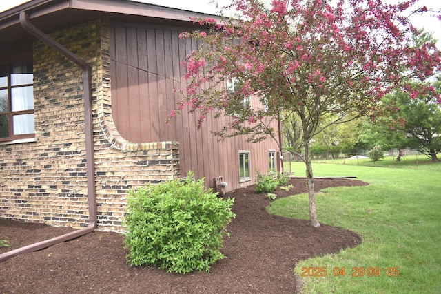 view of home's exterior featuring a yard