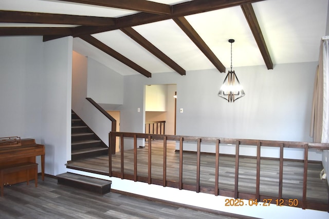 staircase with vaulted ceiling with beams, a notable chandelier, and wood finished floors
