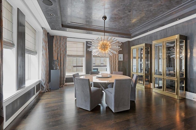 159 E Walton Pl Unit 5G, Chicago, IL 60611 - dining area with a tray ceiling, a chandelier, and dark wood-type flooring