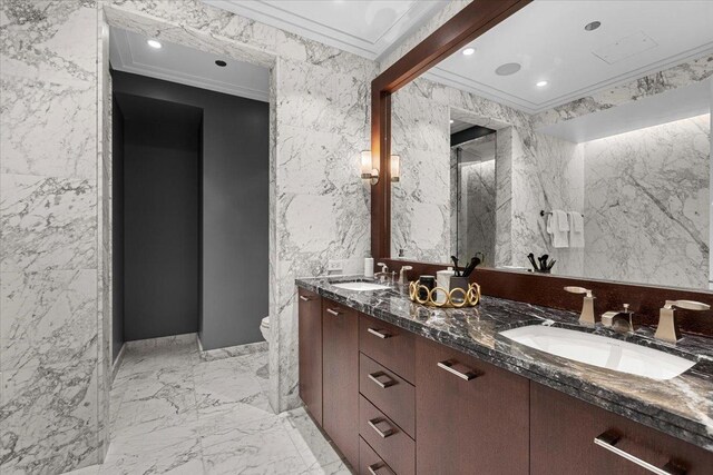 159 E Walton Pl Unit 5G, Chicago, IL 60611 - bathroom with crown molding, marble finish flooring, double vanity, tile walls, and recessed lighting