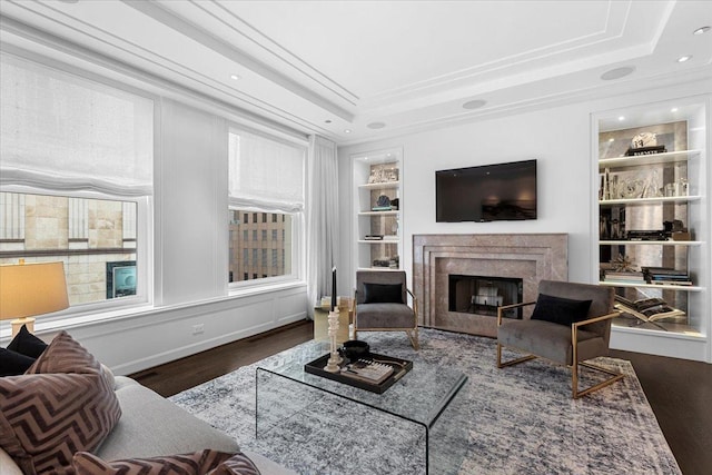 159 E Walton Pl Unit 5G, Chicago, IL 60611 - living area with wood finished floors, built in shelves, a premium fireplace, a raised ceiling, and ornamental molding