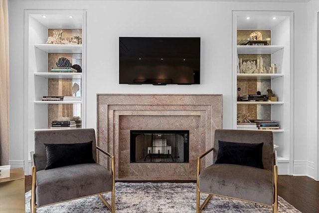 159 E Walton Pl Unit 5G, Chicago, IL 60611 - living area with a high end fireplace, built in features, wood finished floors, and recessed lighting