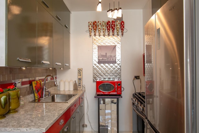 1755 E 55th St Unit 1102, Chicago, IL 60615 - kitchen with tasteful backsplash, appliances with stainless steel finishes, light countertops, and a sink