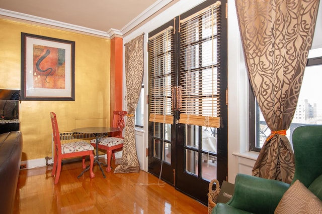 1755 E 55th St Unit 1102, Chicago, IL 60615 - sitting room featuring wood finished floors and crown molding