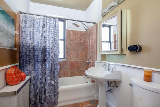 1755 E 55th St Unit 1102, Chicago, IL 60615 - bathroom with shower / bathtub combination with curtain, a healthy amount of sunlight, toilet, and wainscoting