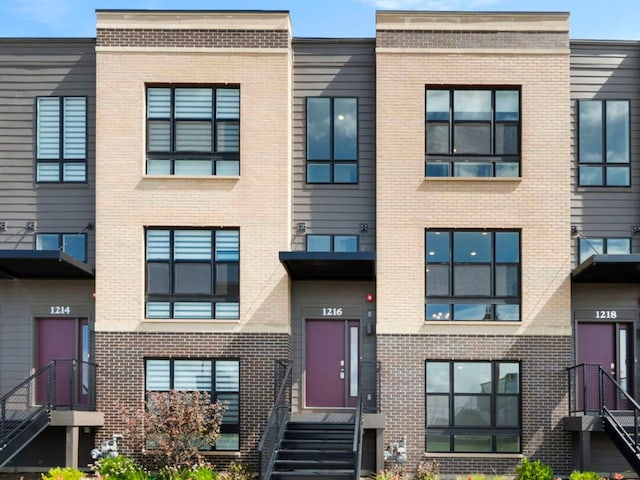 view of front of house with brick siding