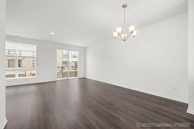 unfurnished room with dark wood-style floors, baseboards, an inviting chandelier, and recessed lighting