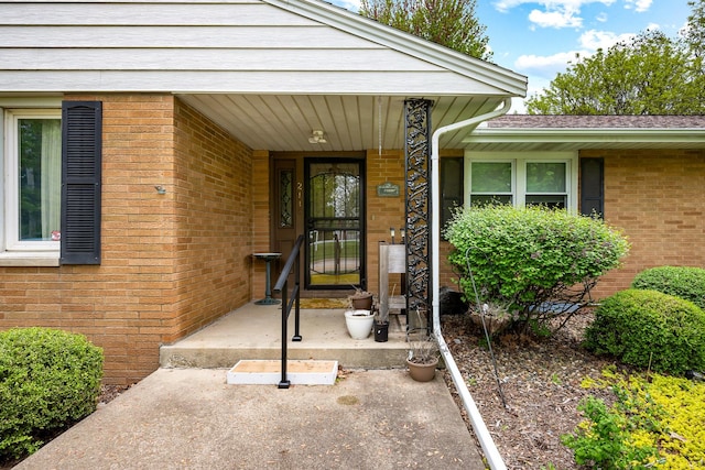 entrance to property with brick siding
