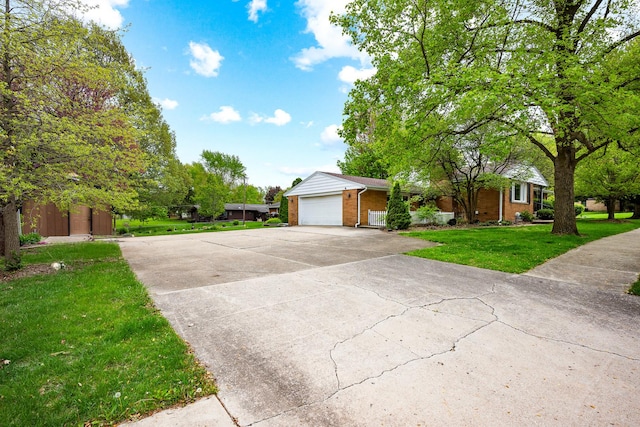 ranch-style house with concrete driveway, brick siding, a front yard, and a garage